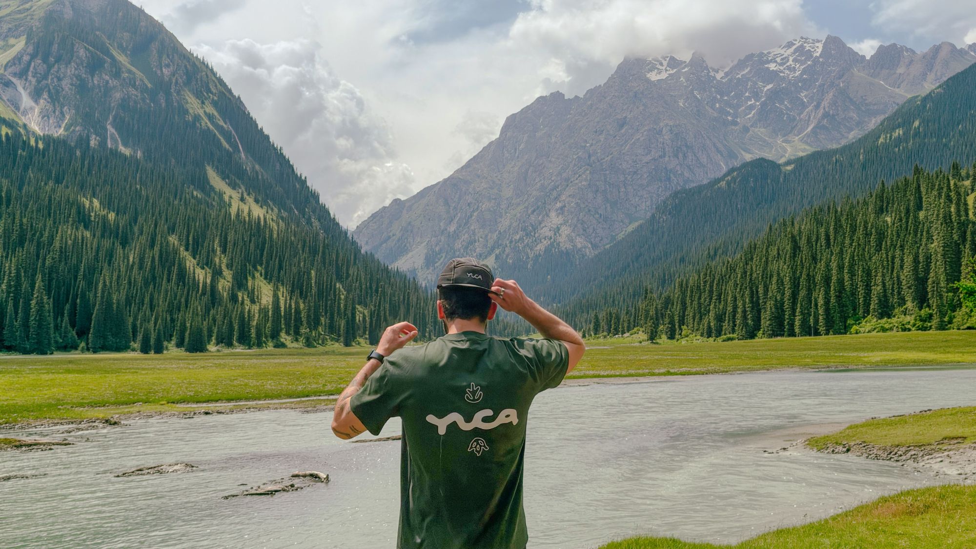 A traveler looking out at the mountains in Kyrgyzstan